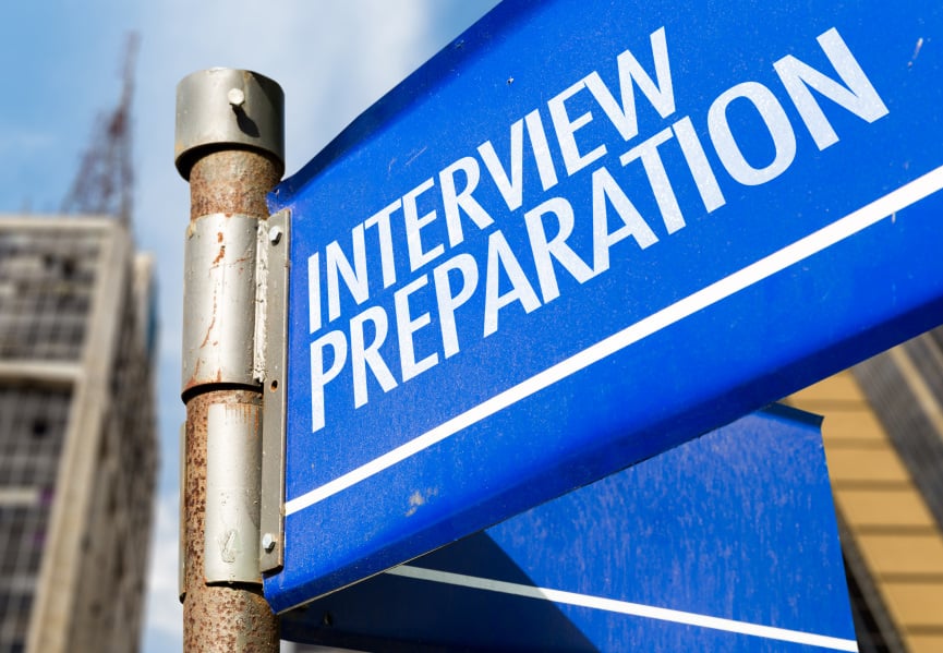 Blue sign on city street for interview preparation